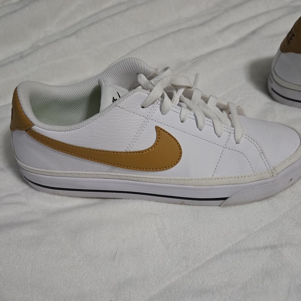 Nike White Sneakers with Gold Accents